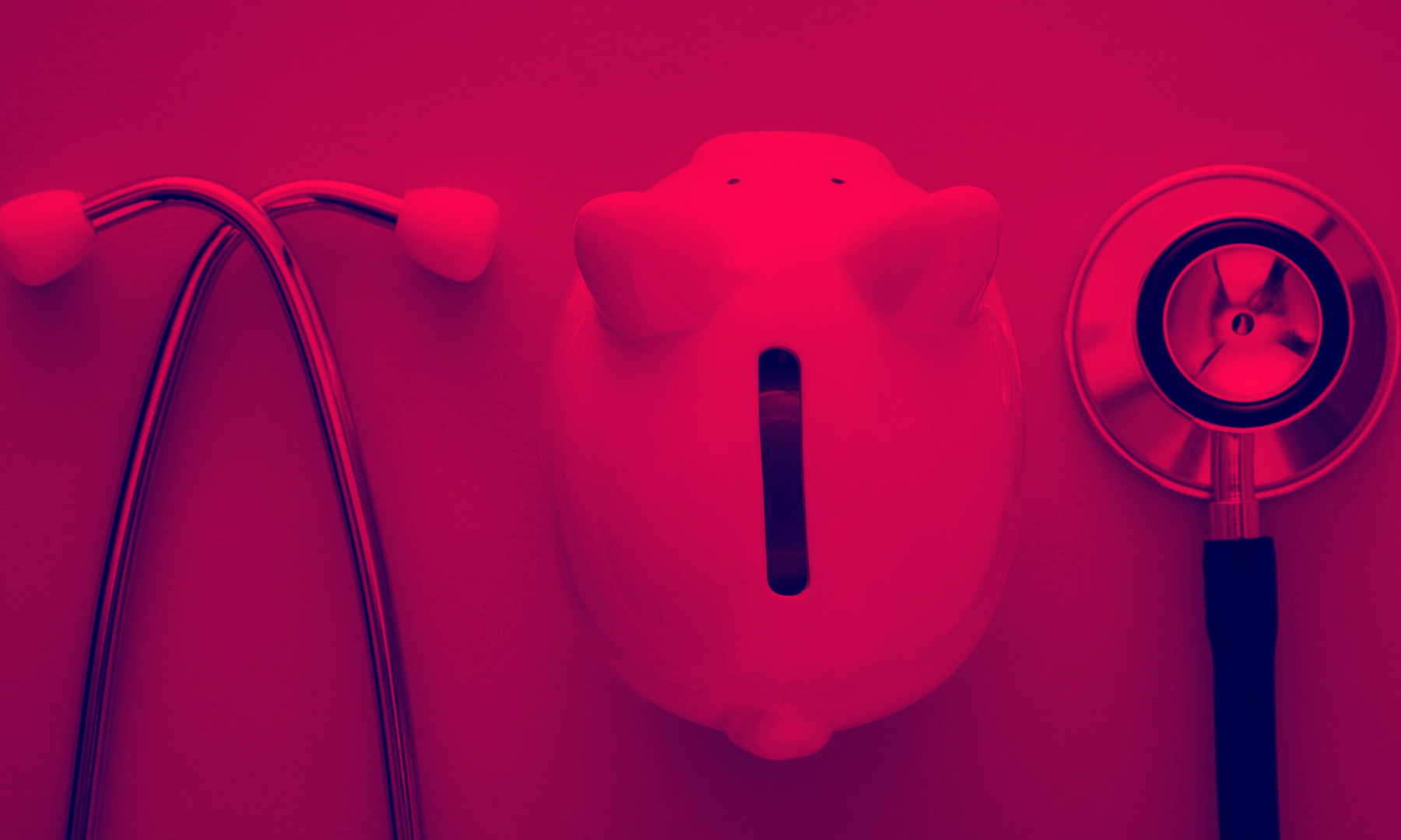 A piggy bank next to a stethoscope